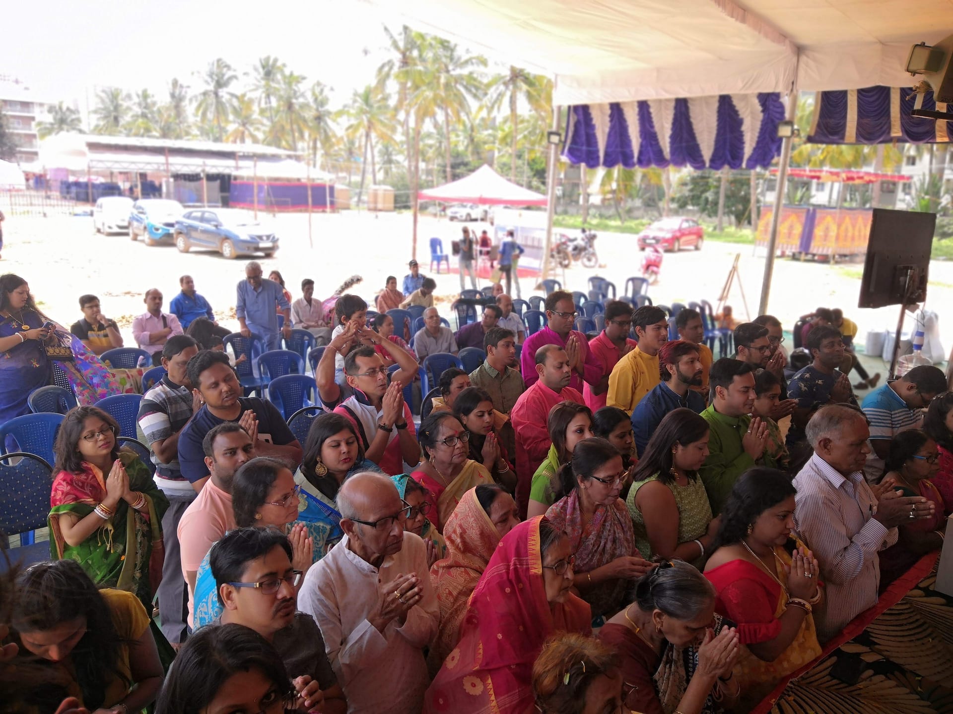 Wide view of the VBA Durga Puja grounds packed with tents and crowds